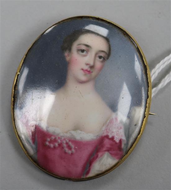 A yellow metal mounted porcelain oval brooch decorated with a portrait of a lady, 48mm.